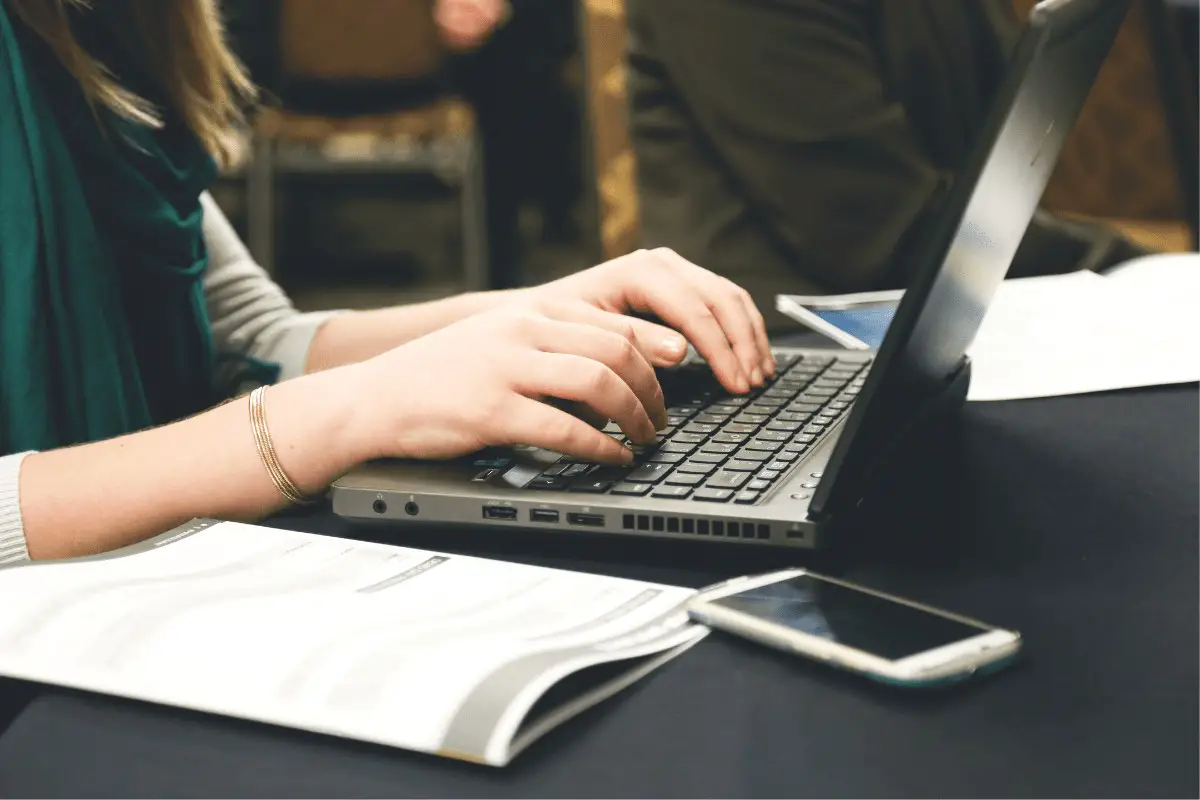 a woman working on a laptop computer