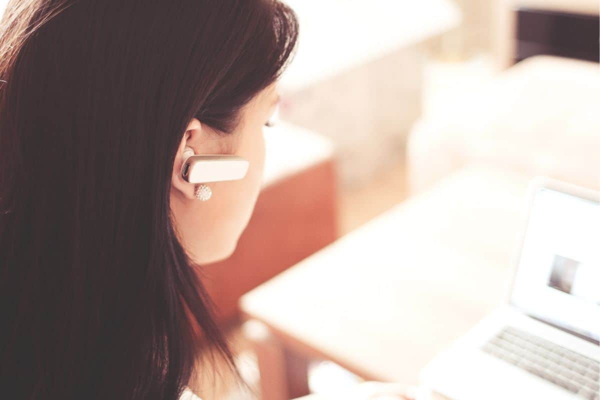 woman with a bluetooth in her ear