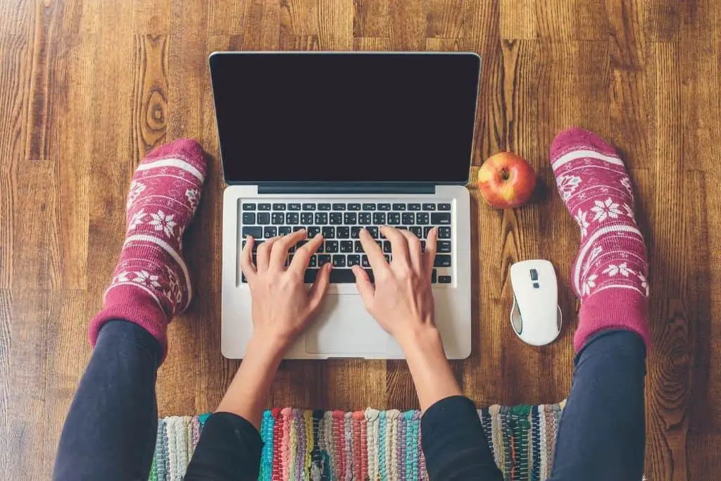 woman typing on laptop computer