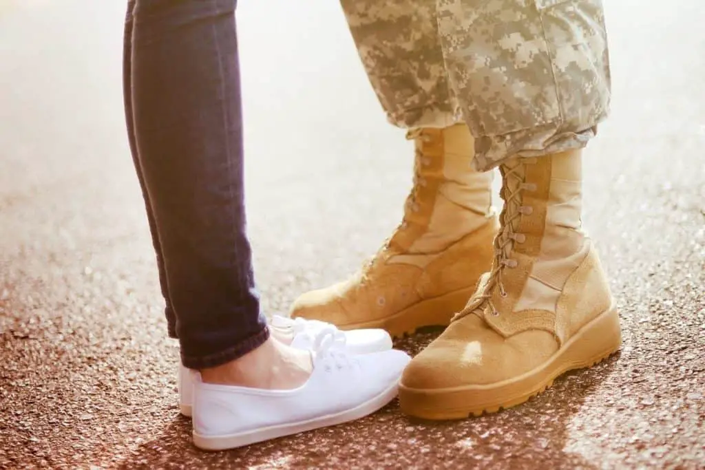 army wife standing with husband