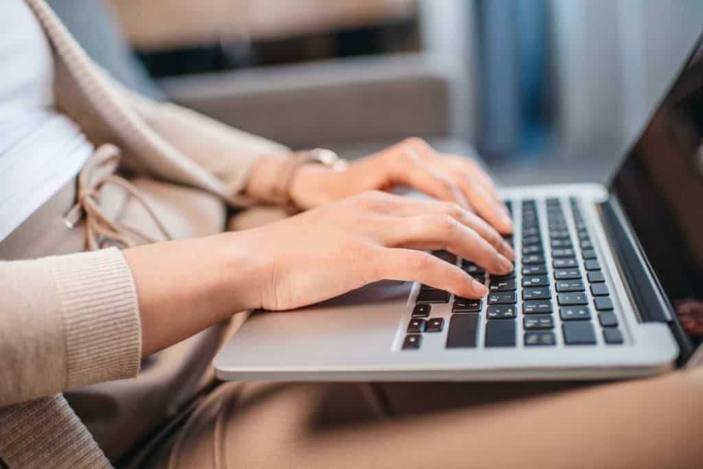 woman typing on keyboard