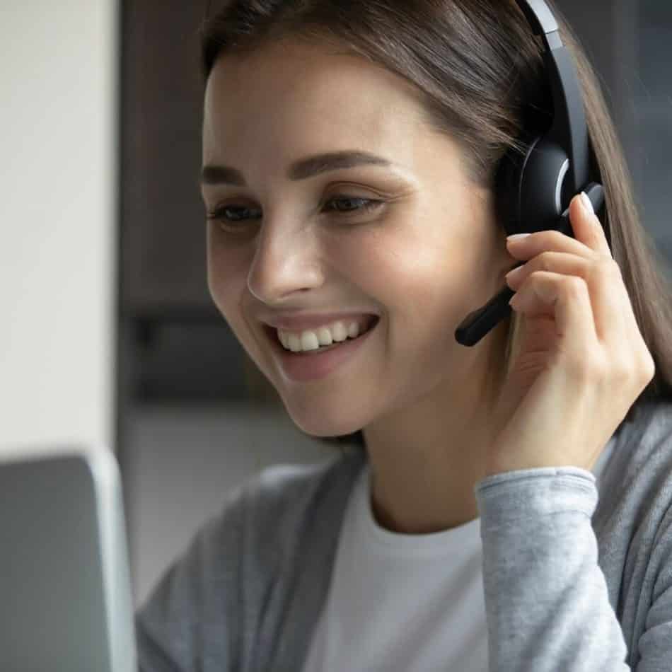 a woman talking with a headpiece on