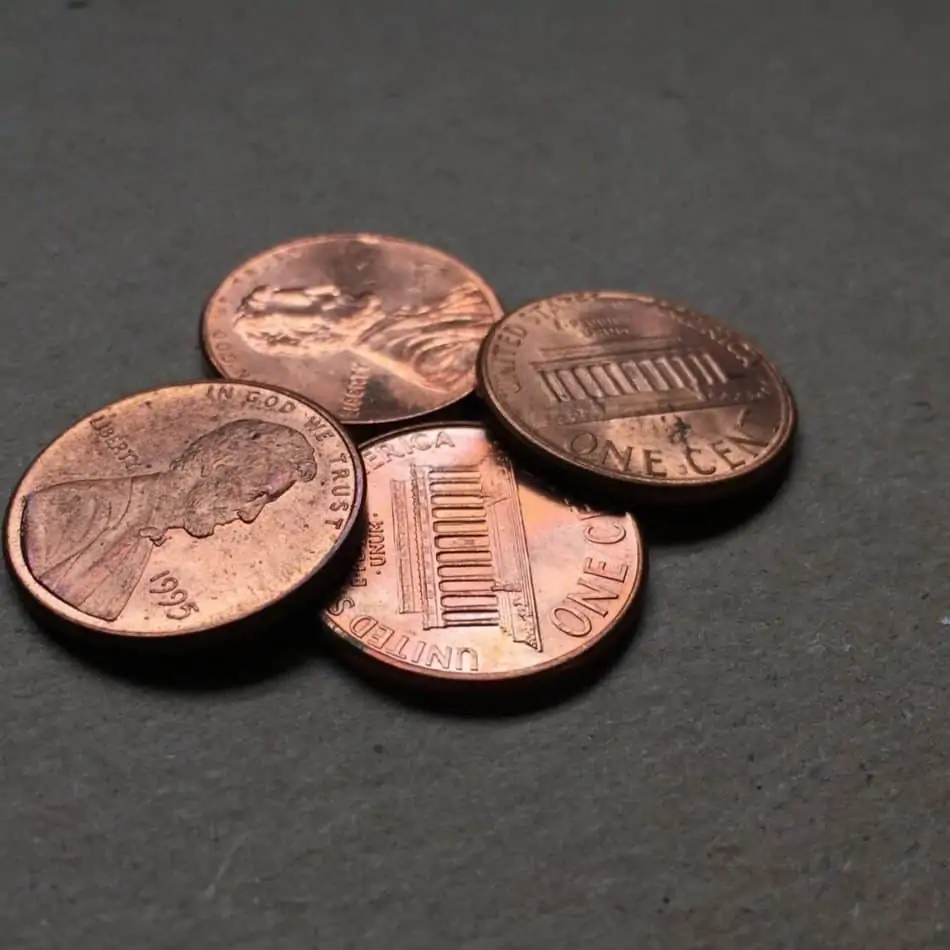 4 pennies on a table
