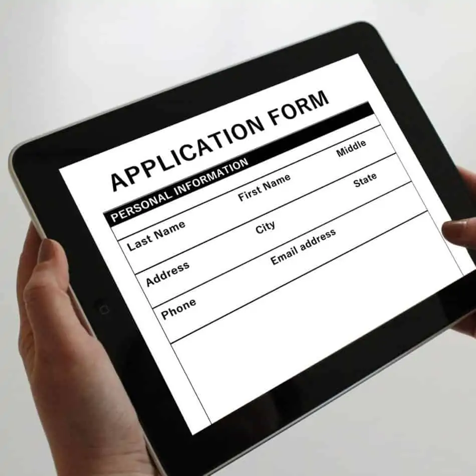 a tabley with an application form on the screen