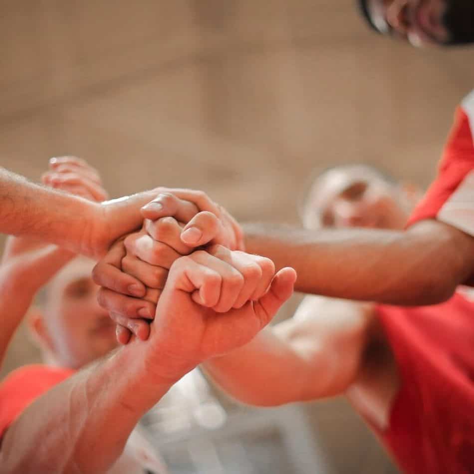 a team putting their fists together