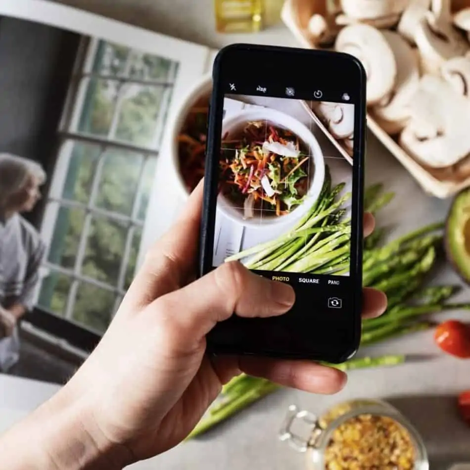 a smartphone taking a picture of food